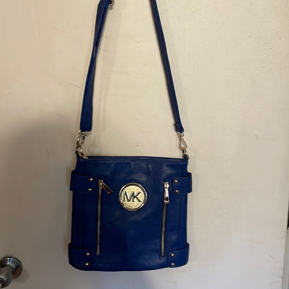 Woman’s Michael kors not real navy blue medium size over shoulder crossbodypurse